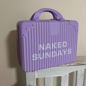 Brand new Naked Sundays little suitcase with cosmetic